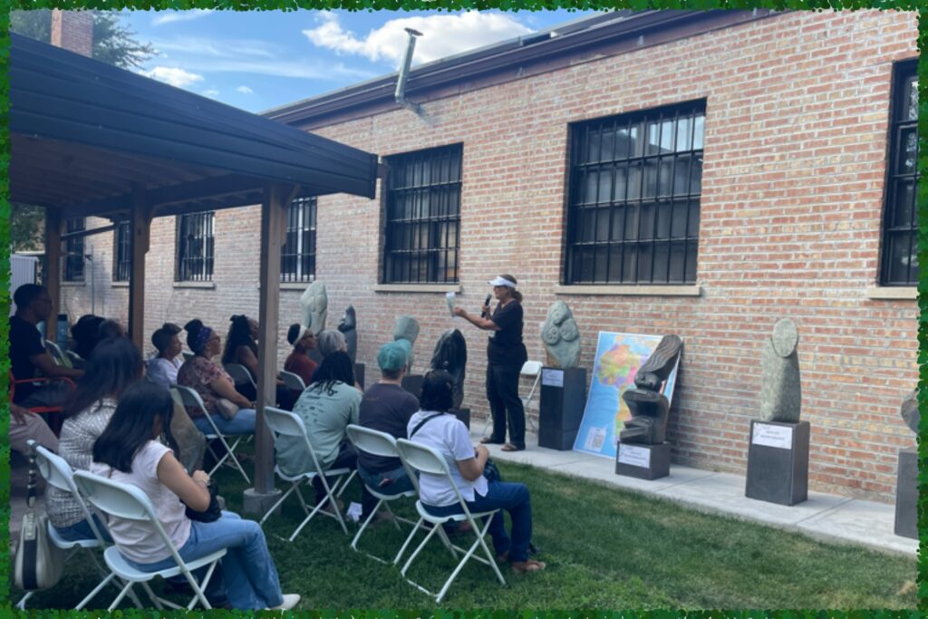 Marianne speaking at the Gaia Art Exhibit